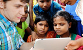 Students looking at tablet