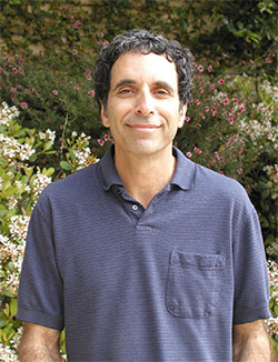 Martin Yanofsky standing in front of plants