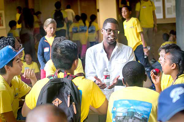 Gentry patrick speaking to a group of children