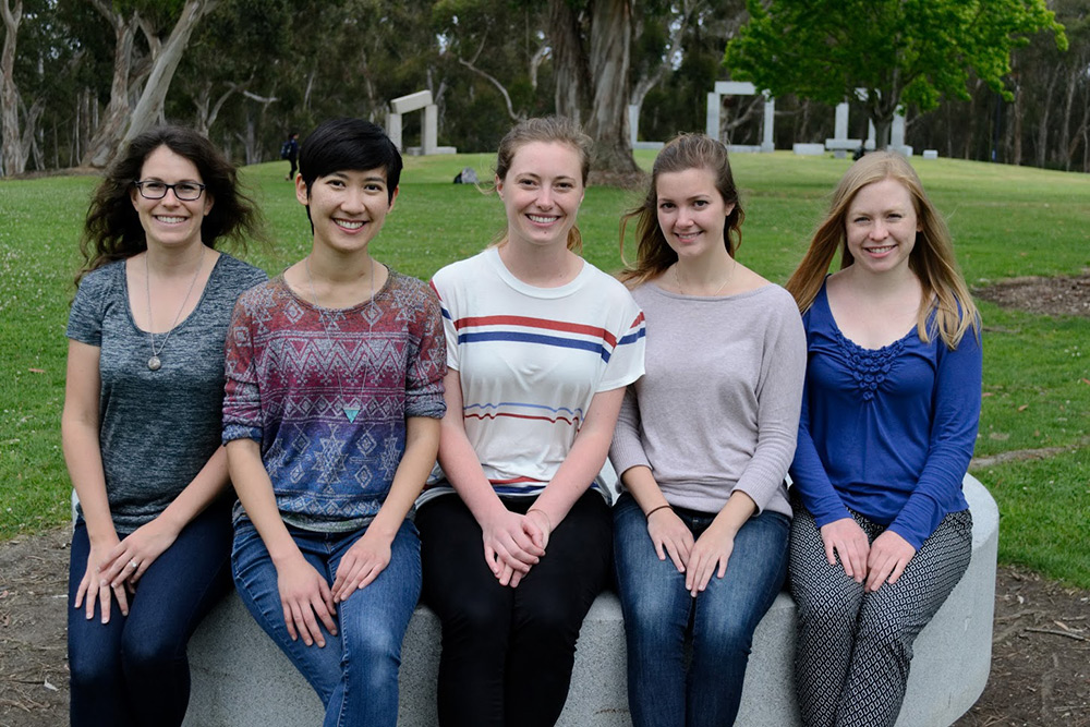 5 students smiling together at the camera